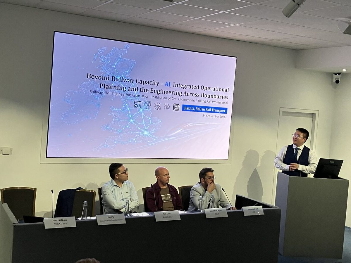 Jiaxi Li presenting at the lectern