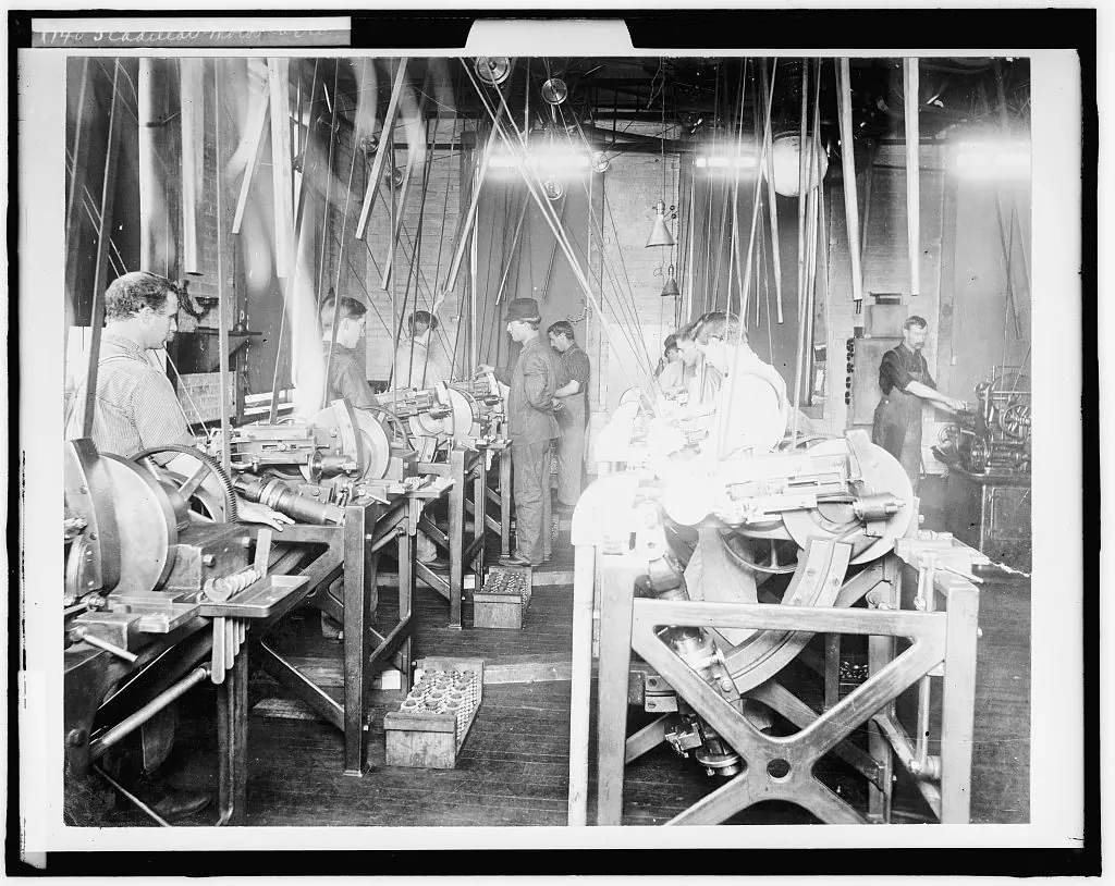 Factory floor with line shafts and belts, about 1900
